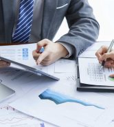 businessmen-elegant-suits-business-meeting-discussing-new-project-office