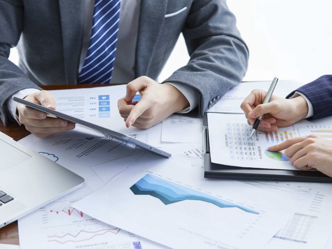 businessmen-elegant-suits-business-meeting-discussing-new-project-office