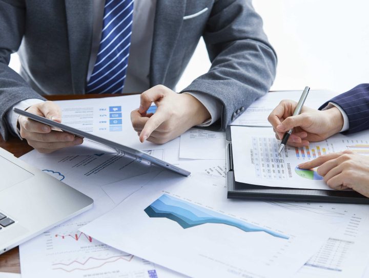 businessmen-elegant-suits-business-meeting-discussing-new-project-office