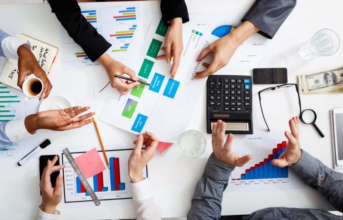 businessmen-hands-white-table-with-documents-drafts